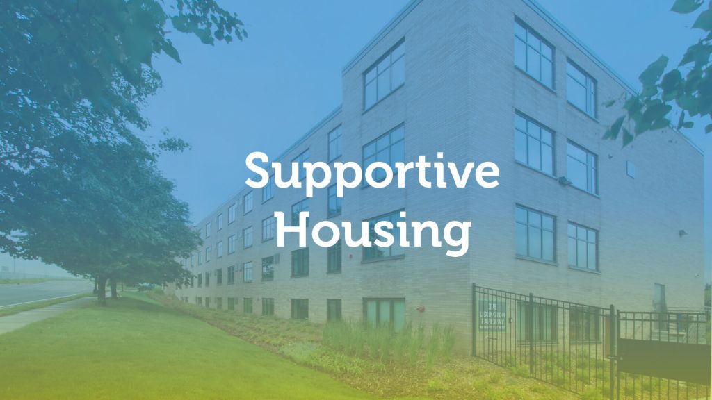 Image text: Supportive Housing, overlaid on a rendering of a large apartment building.